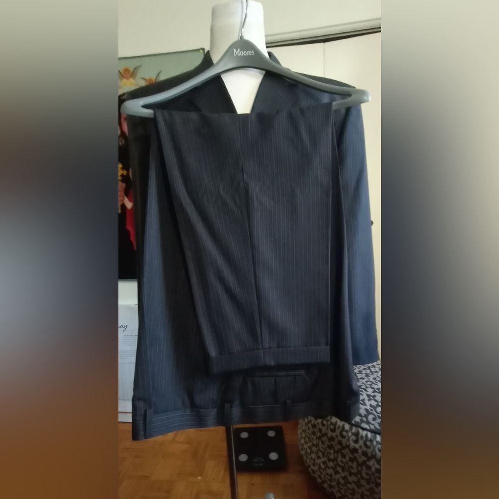 Pronto Uomo men’s dark grey pinstriped suit.